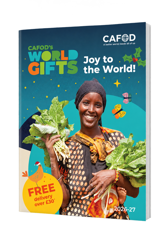 3D mock-up of the CAFOD World Gifts 2026–27 catalogue, showing the Joy to the World cover, on a transparent background.