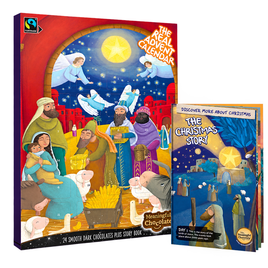 The Real Advent Calendar dark chocolate box with its accompanying Christmas story booklet, on a transparent background.