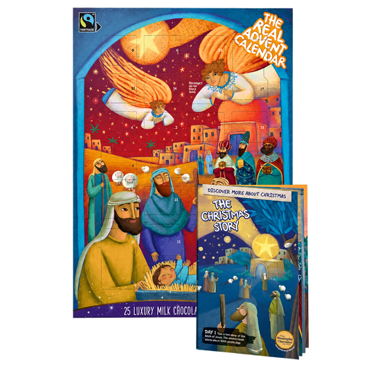 The Real Advent Calendar milk chocolate box with its accompanying Christmas story booklet, on a transparent background.